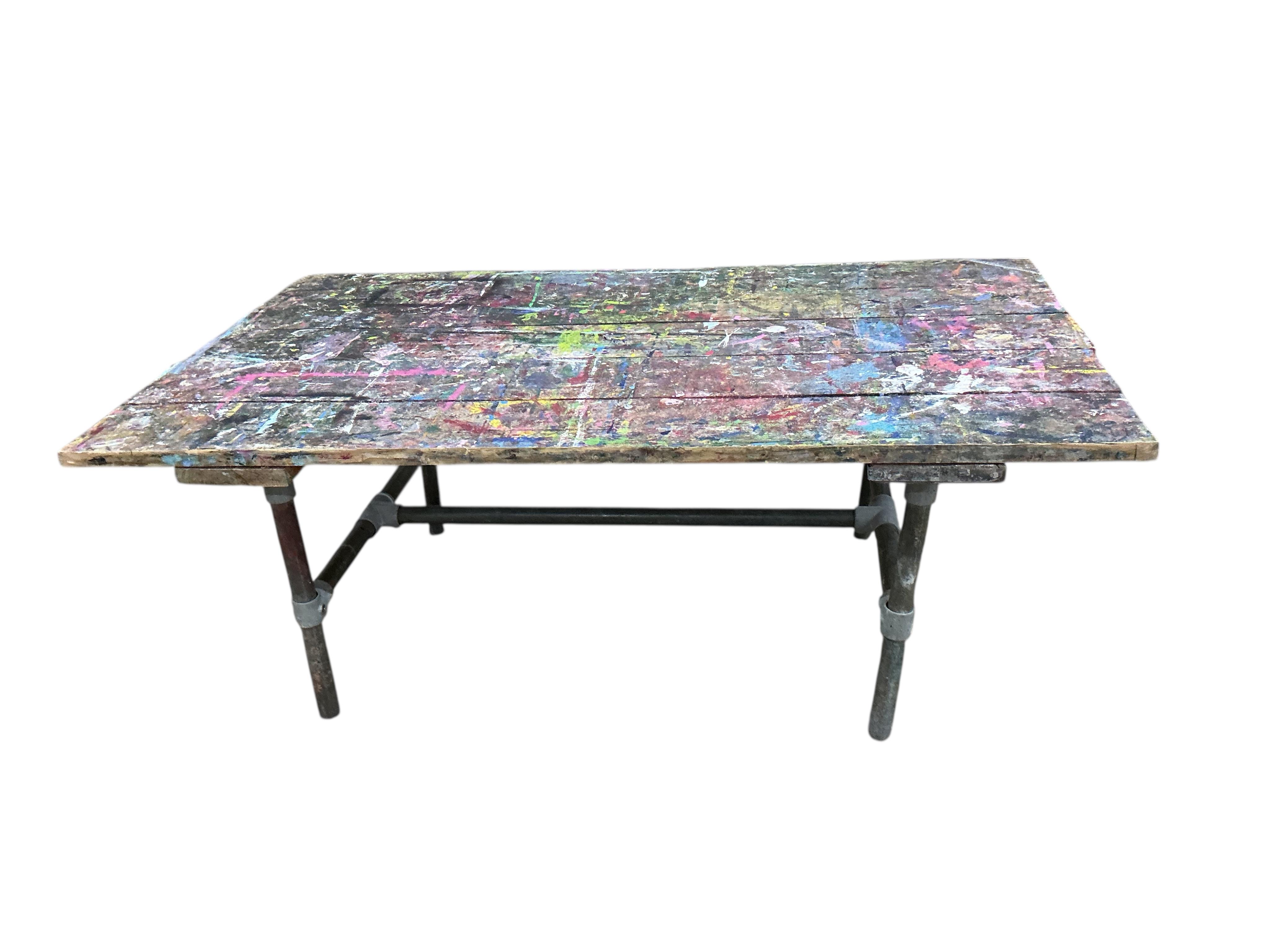 An industrial style rectangular artist's studio work table, width 195cm, depth 112cm, height 75cm